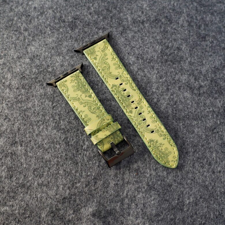 Green patterned Apple Watch band shown beside a watch face